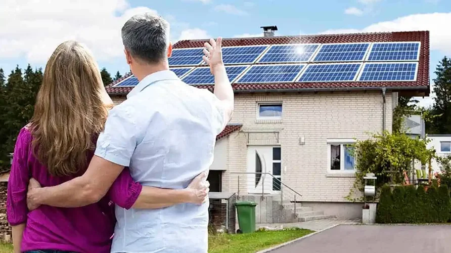 image of a house with solar installed with a satisfied customer